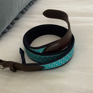 Man’s vineyard vines belt with beer bottles
